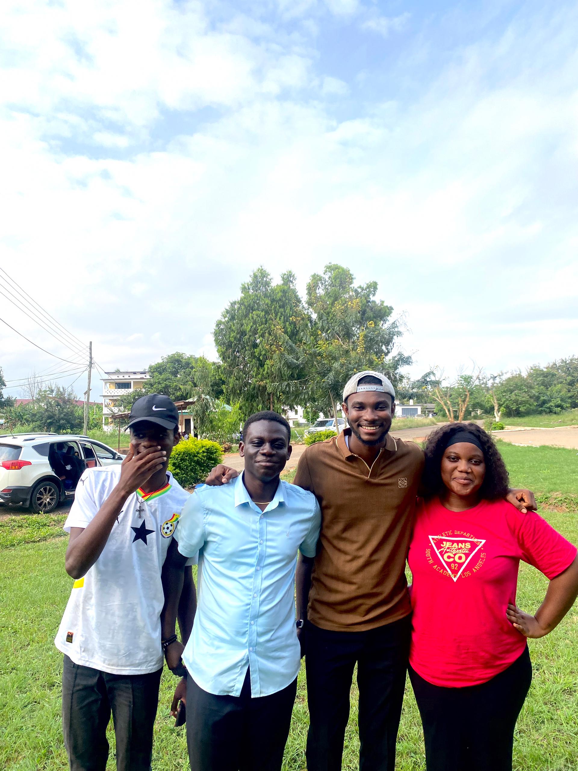 A member of the Kings & Priests movement in a mustard shirt dances with eyes closed against a black background.