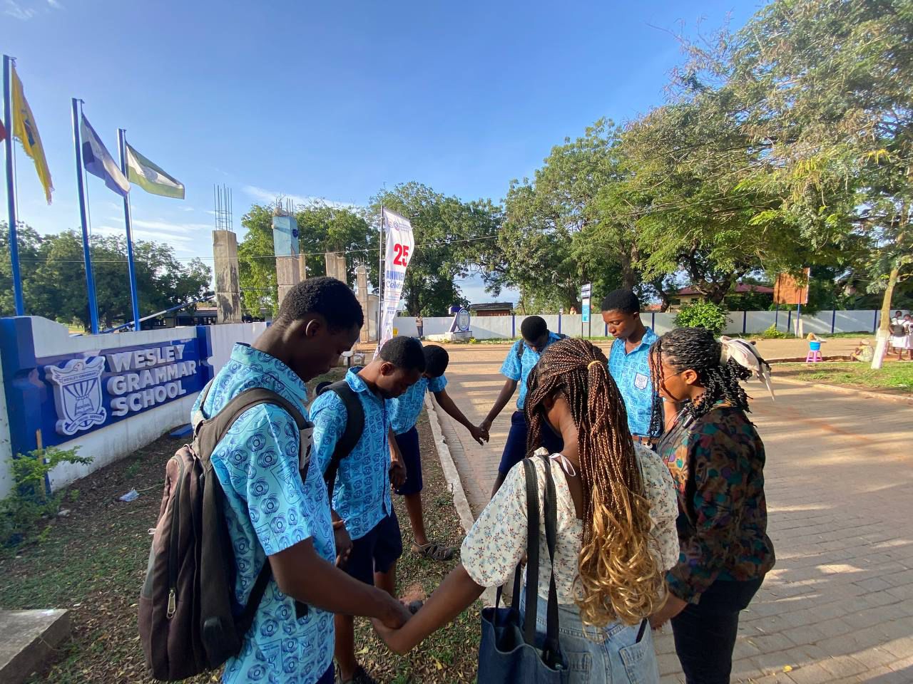 Kings & Priests yearbook portrait bathed in blue light, capturing the community’s worshipful atmosphere.