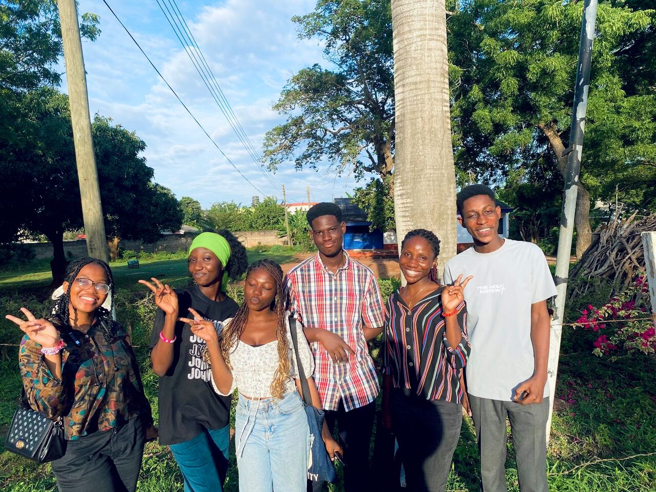 Kings & Priests yearbook portrait captured against a deep indigo backdrop, highlighting a worshipful pose.